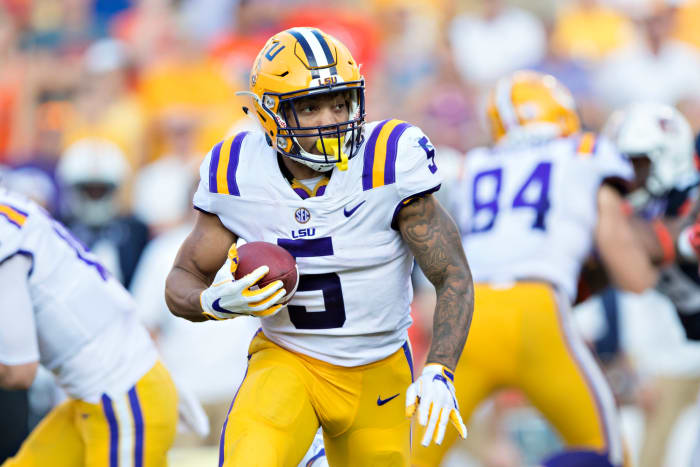 LSU star Derrius Guice carries the ball.