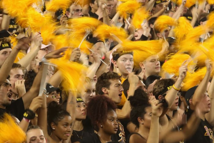 Arizona State fans cheering during a football game.
