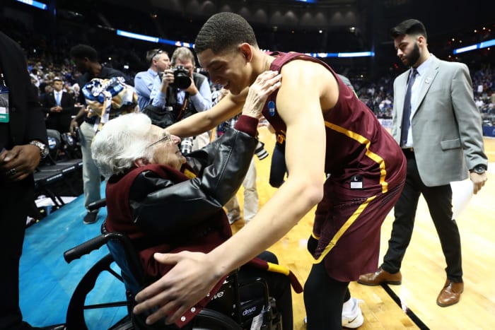 Sister Jean hugs Loyola's Lucas Williamson.