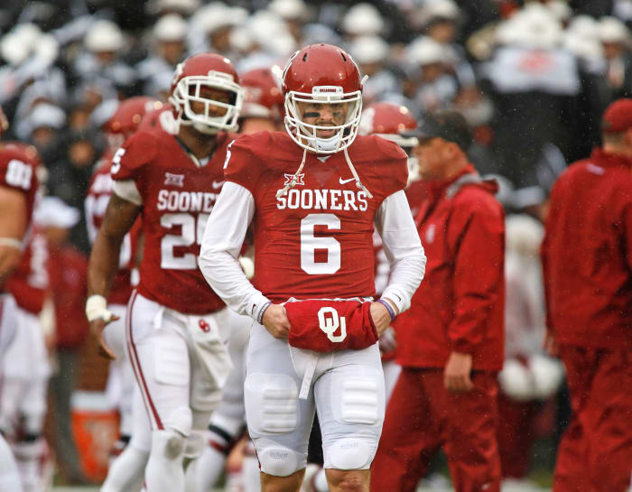 Baker Mayfield with his hands inside a hand warmer.