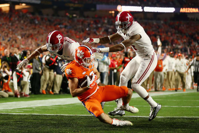 Hunter Renfrow #13 of the Clemson Tigers catches a 31 yard touchdown pass from Deshaun Watson #4 in the first quarter against the Alabama Crimson Tide.