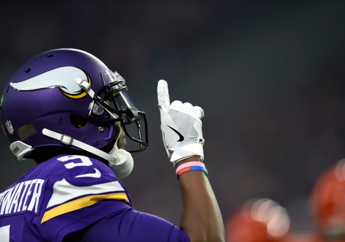 Teddy Bridgewater points to the sky during a game.