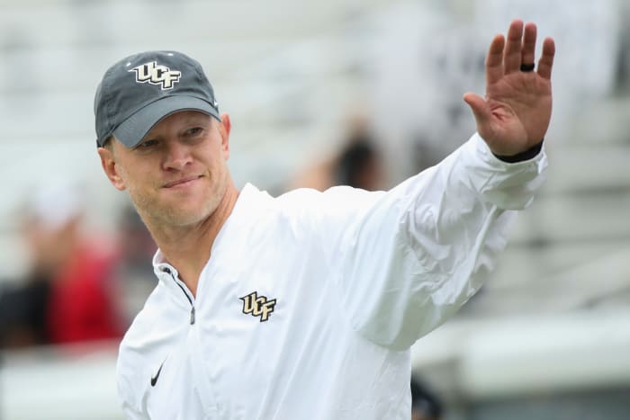 Scott Frost waves to fans.