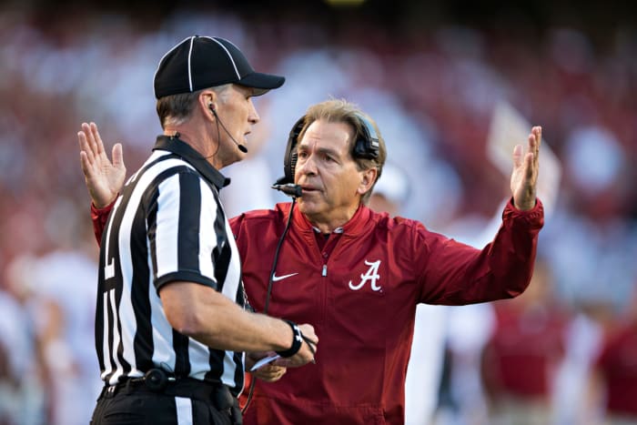 Head Coach Nick Saban of the Alabama Crimson Tide argues with a official during a game against the Arkansas Razorbacks.