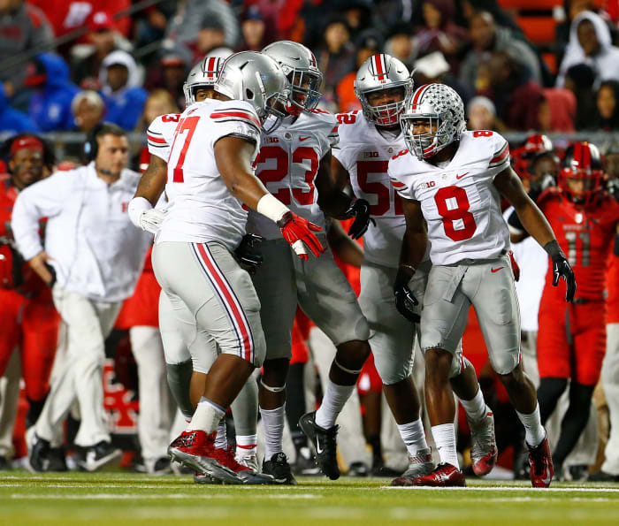 Ohio State's defense celebrating on the football field/