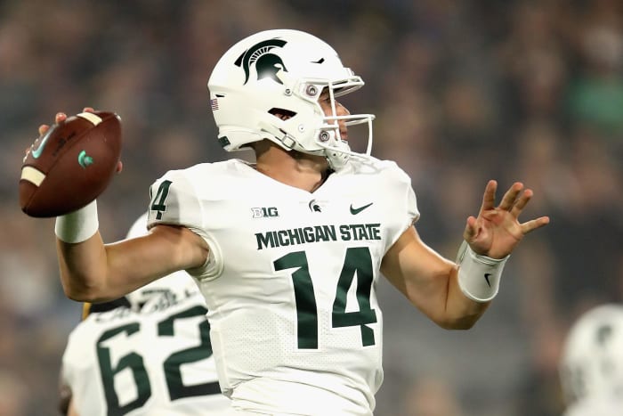 Brian Lewerke throws a pass for Michigan State.