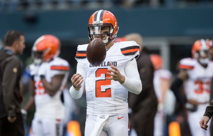 Johnny Manziel spins the football as he warms up for the Browns.