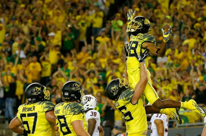 Oregon players celebrate a Dwayne Stanford touchdown.