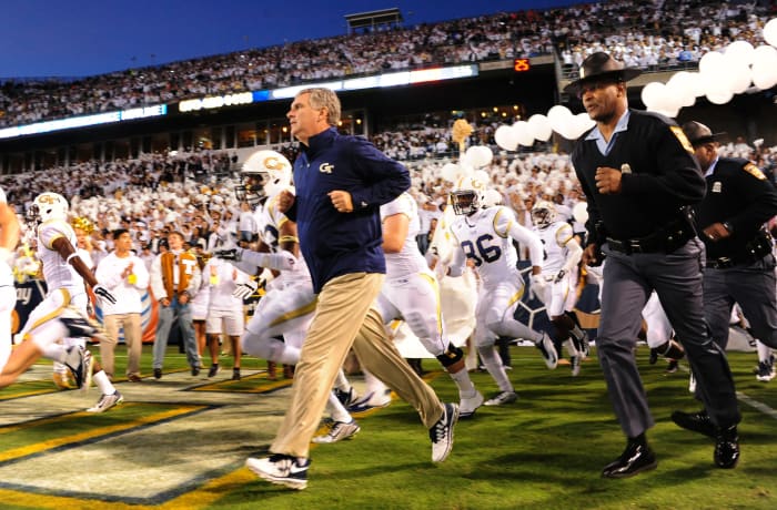 Paul Johnson leading his Georgia Tech football team onto the field.