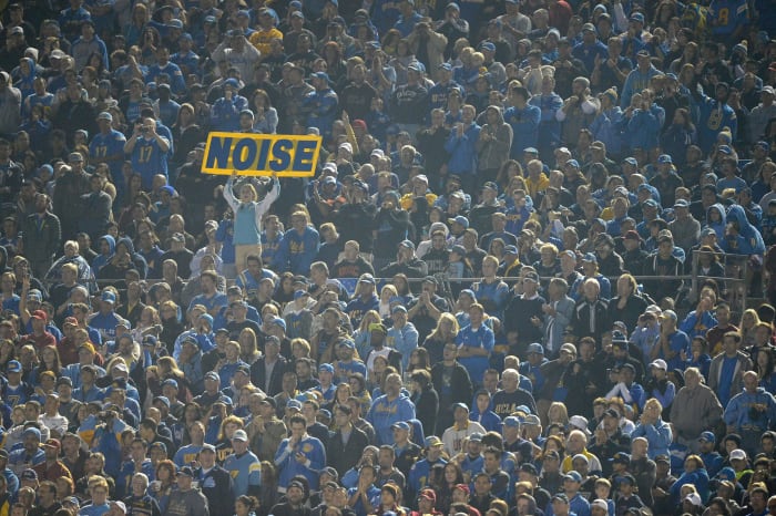 A UCLA Bruins fan holds up a noise sign during a 38-14 win over the USC Trojans at the Rose Bowl.
