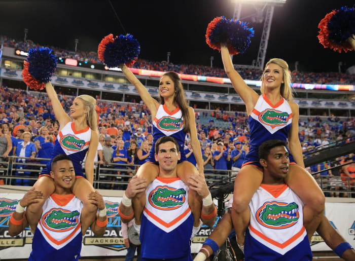 Florida Gators cheerleaders performing during a football game.