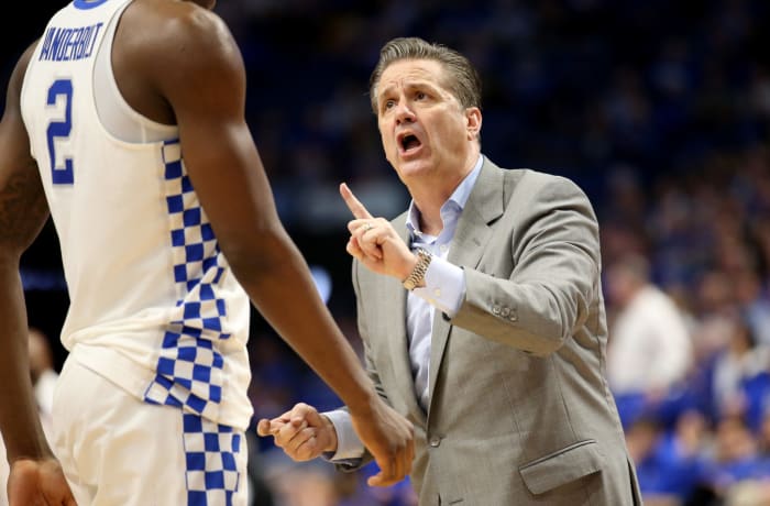 John Calipari the head coach of the Kentucky Wildcats gives instructions to Jarred Vanderbilt.