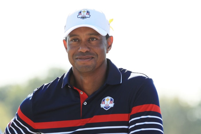 Tiger Woods smiles during a practice round.
