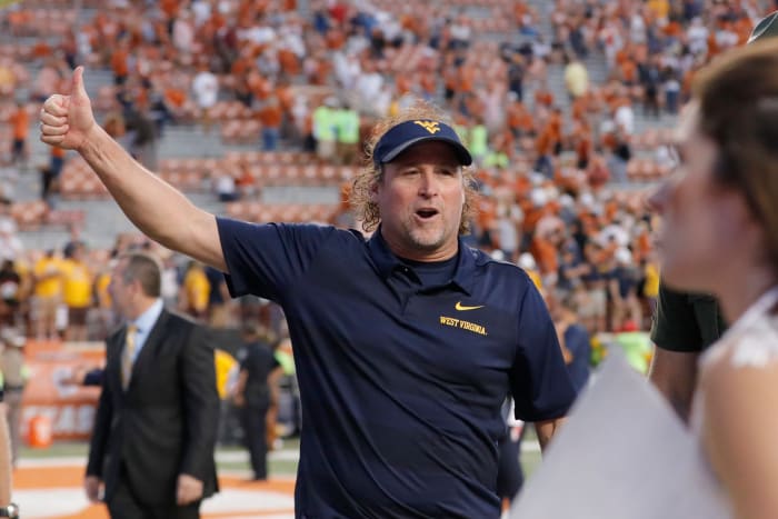 Dana Holgorsen celebrating against the Texas Longhorns.