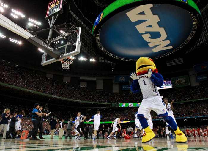 Kansas' mascot celebrating during a basketball game.