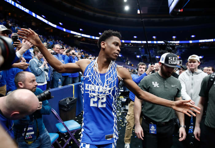 Kentucky guard Shai Gilgeous-Alexander wears a net after winning the SEC.