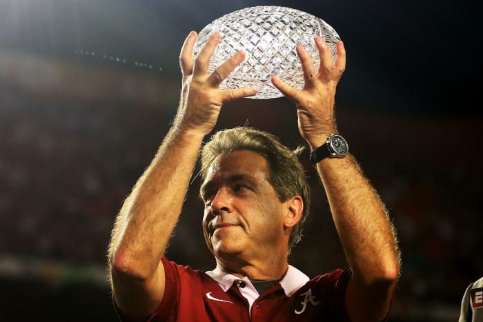 Head coach Nick Saban of the Alabama Crimson Tide celebrates with the trophy after defeating the Notre Dame Fighting Irish in the 2013 Discover BCS National Championship game.