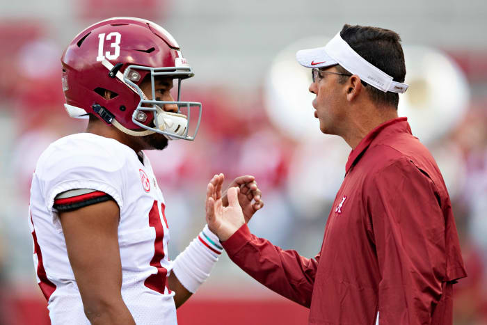 Alabama quarterbacks coach Dan Enos speaks to Tua Tagovailoa.