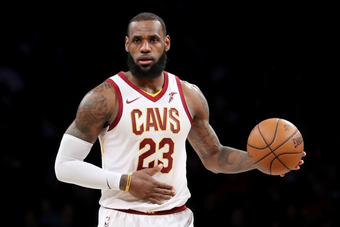 LeBron James dribbling the ball.
