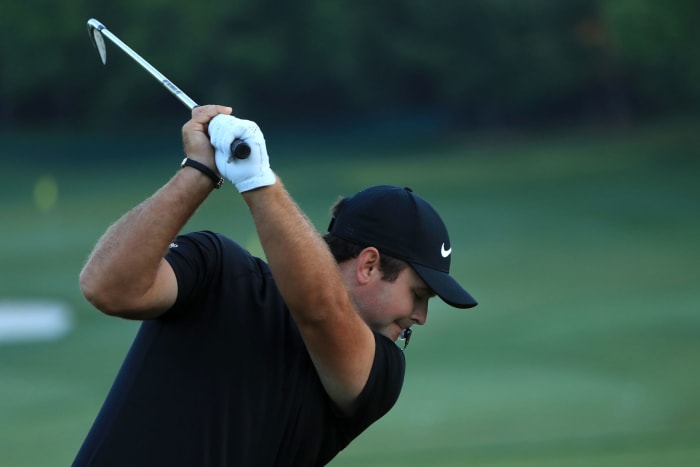 Patrick Reed following through with a shot.