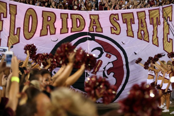 A banner with Florida State's logo on the field before a game.
