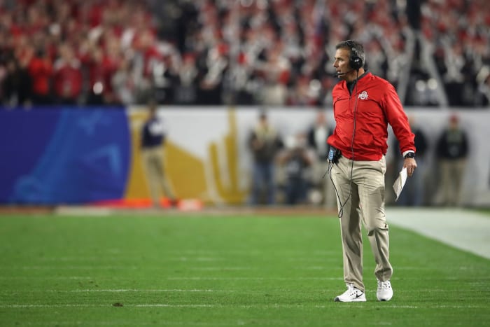 A closeup of Urban Meyer wearing an Ohio State jacket.