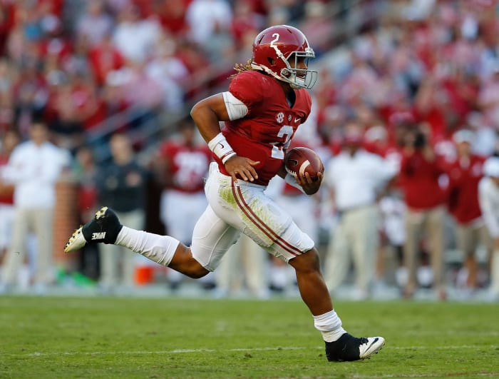 Jalen Hurts of the Alabama Crimson Tide rushes for a touchdown against the Texas A&M Aggies at Bryant-Denny Stadium.