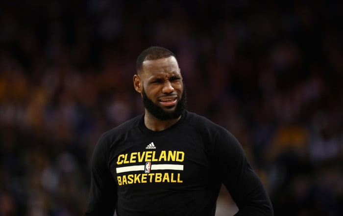 LeBron James of the Cleveland Cavaliers stands on the court during their game against the Golden State Warriors.