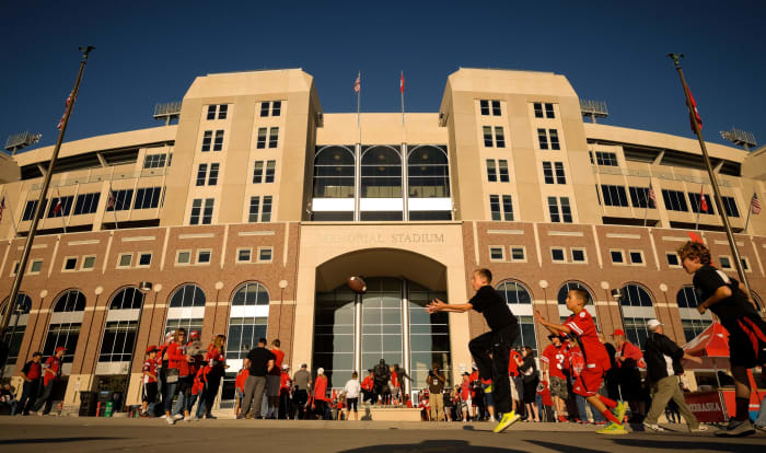 Nebraska fans play football outside Memorial Stadium.
