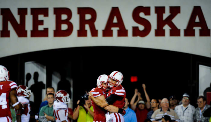 Taylor Martinez celebrates with Jake Long.