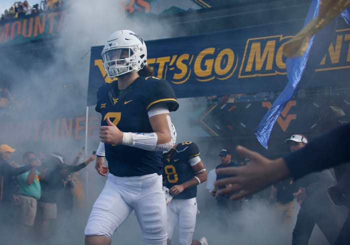 Will Grier of the West Virginia Mountaineers takes the field against the Iowa State Cyclones at Mountaineer Field.