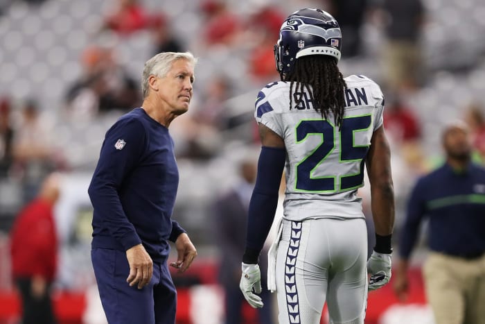 Richard Sherman talking to Pete Carroll.
