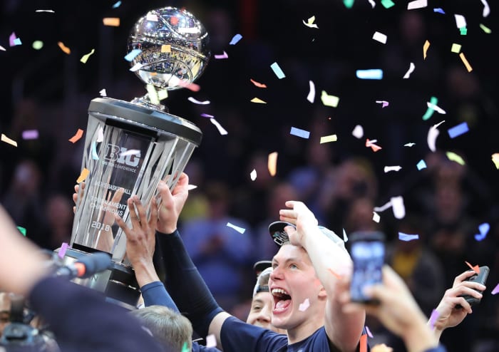 Tournament MVP Moe Wagner of the Michigan Wolverines celebrates after defeating the Purdue Boilermakers 75-66 during the championship game of the Big 10 Basketball Tournament.