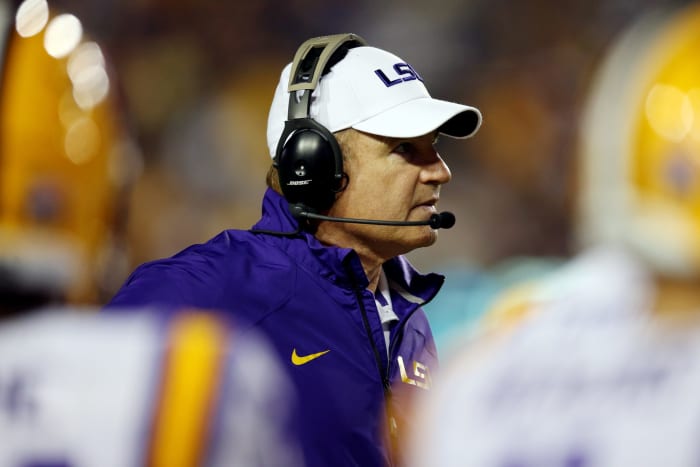 Les Miles looks out onto the field from the sideline.