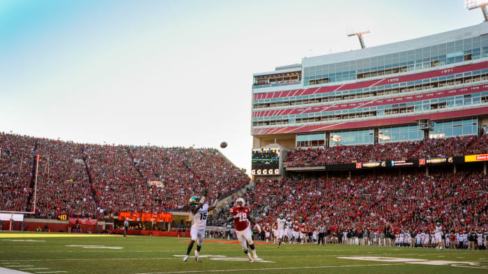 Cornerback Trae Waynes #15 of the Michigan State Spartans and wide receiver Quincy Enunwa #18 of the Nebraska Cornhuskers reach for a pass during their game at Memorial Stadium.