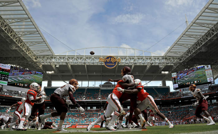 Miami players hit Bethune Cookman's quarterback.
