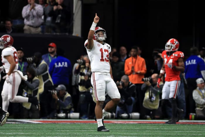 Tua Tagovailoa of the Alabama Crimson Tide celebrates a six yard touchdown pass during the third quarter against the Georgia Bulldogs.