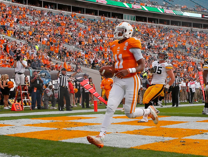 Josh Dobbs scores a touchdown against Iowa.