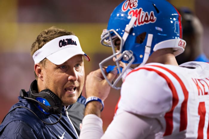 Hugh Freeze talking to Chad Kelly.