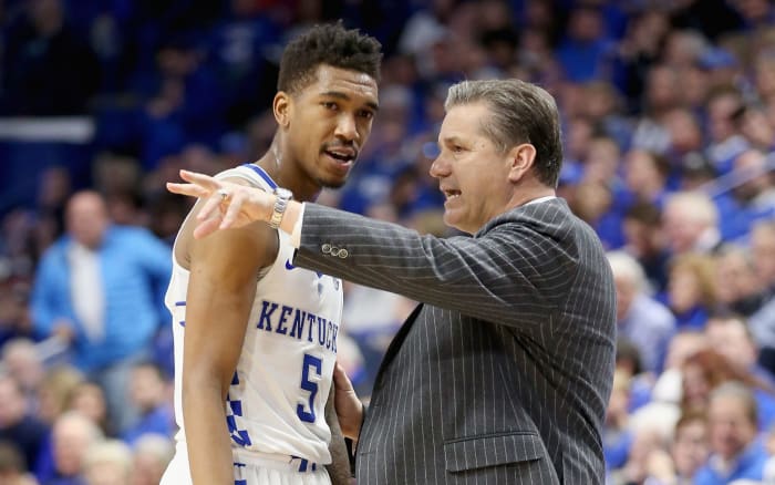 Coach Cal instructing Malik Monk.