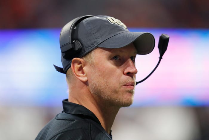 Scott Frost wears a UCF hat.