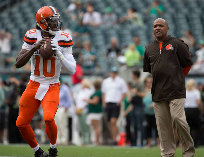 Robert Griffin III throwing passes as Hue Jackson watches.