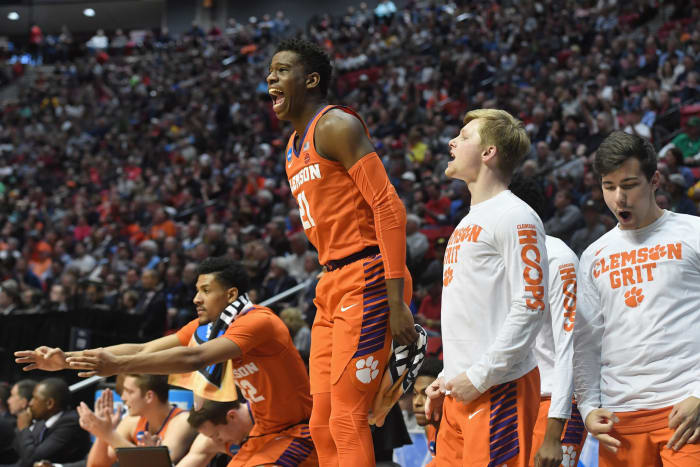 Clemson's basketball players celebrate a score.