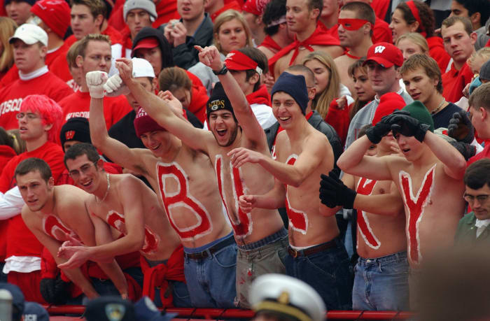 Ohio State Buckeyes fans with Buckeyes written on their chests.