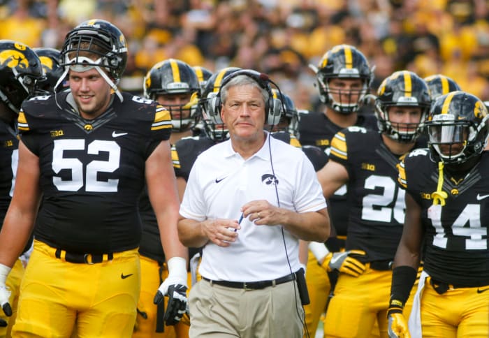 Kirk Ferentz on the sideline with his team.