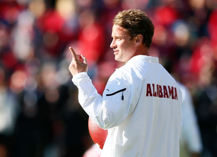 A picture of Lane Kiffin wearing a white Alabama windbreaker.