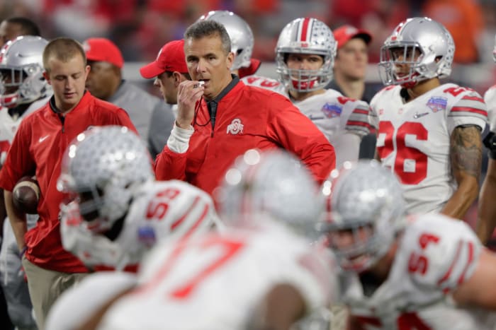 Urban Meyer blowing a whistle during Ohio State warmups.