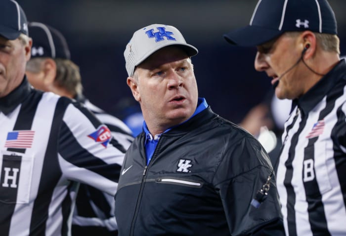 Mark Stoops looks angrily at the officials.