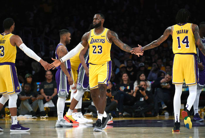 lebron james celebrates during a game against sacramento