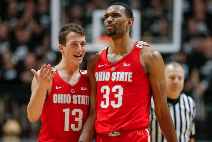 Andrew Dakich and Keita Bates-Diop talk on the court during a game at Purdue.